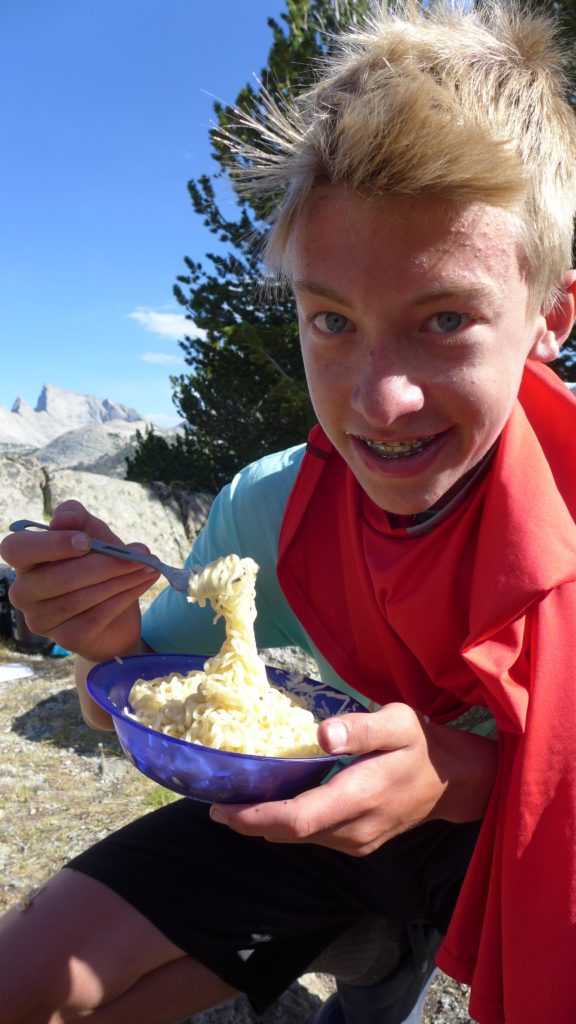 Hayden, eating Epic Buttery, Cheesy Noodles.